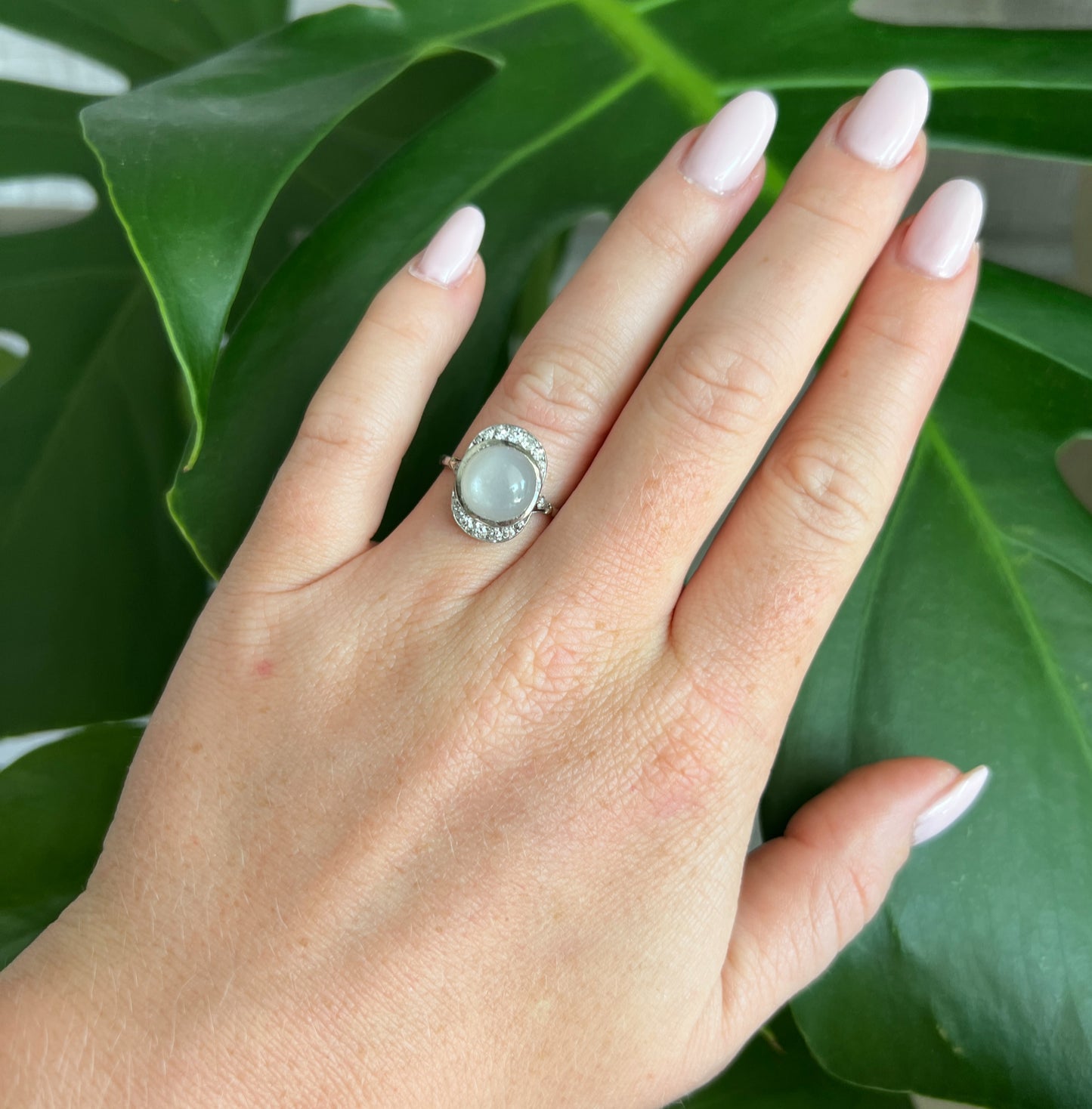 art deco ring in 18 carat gold with moonstone diamonds, worn