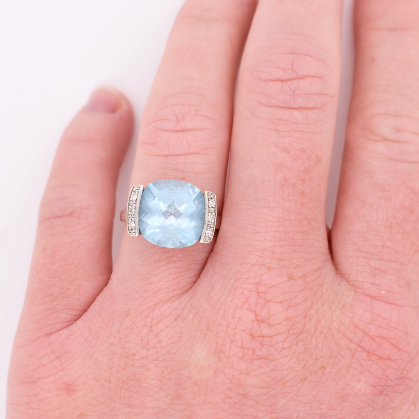18-carat white gold topaz and diamond ring, worn