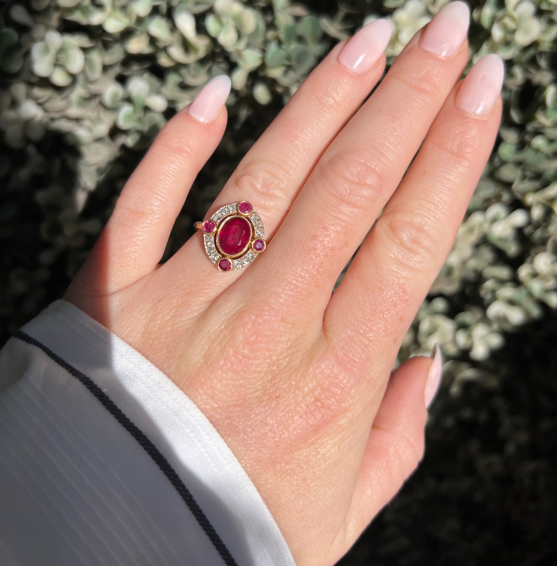 vintage 18-carat gold Burmese ruby and diamond halo ring, worn