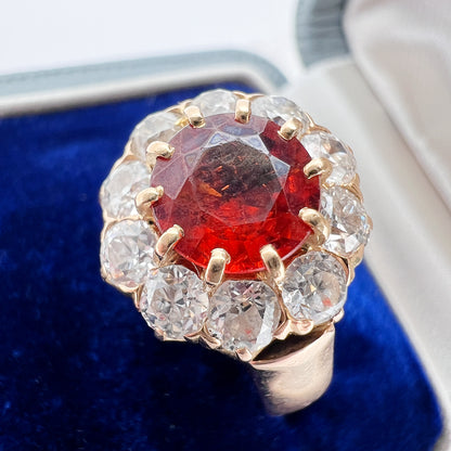 bague marguerite vintage or grenat et diamants. écrin